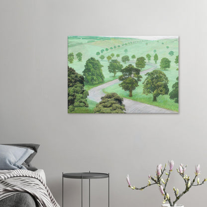 David Hockney canvas print of Green Valley, showing open fields, flowering trees and a winding road in soft, misty colours.