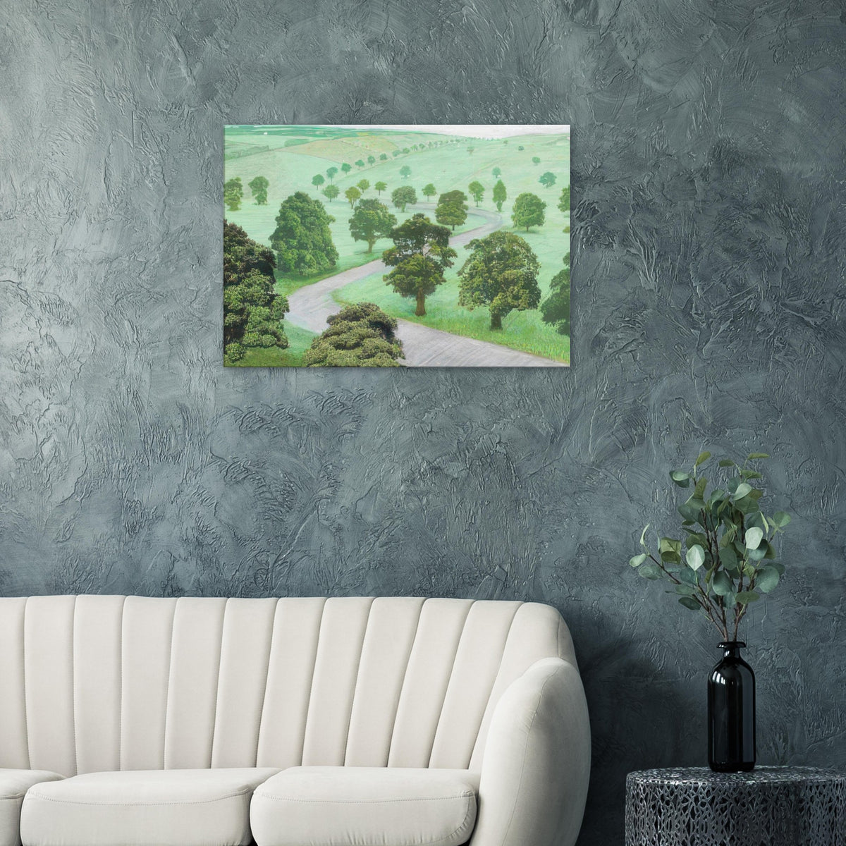David Hockney canvas print of Green Valley, showing open fields, flowering trees and a winding road in soft, misty colours.